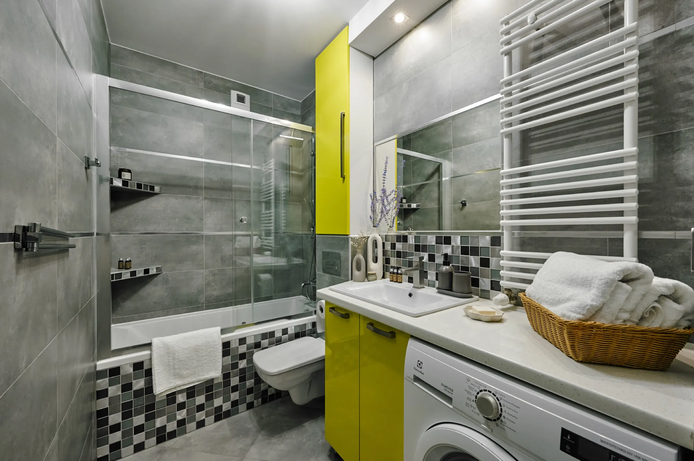 Bathroom with a shower and washing machine