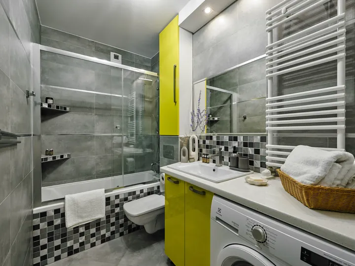 Bathroom with a shower and washing machine