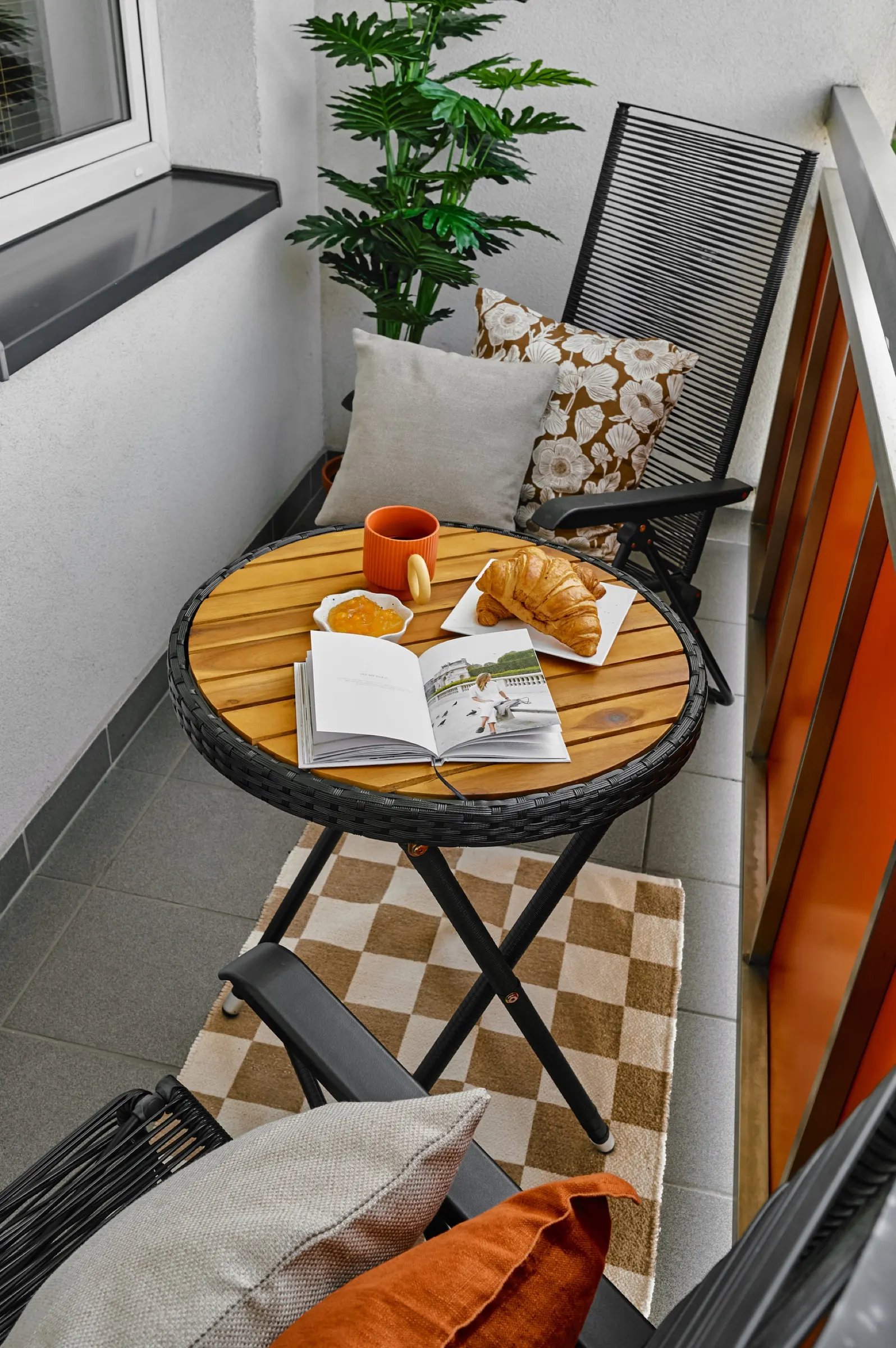 Balcony with a small table and a lounger