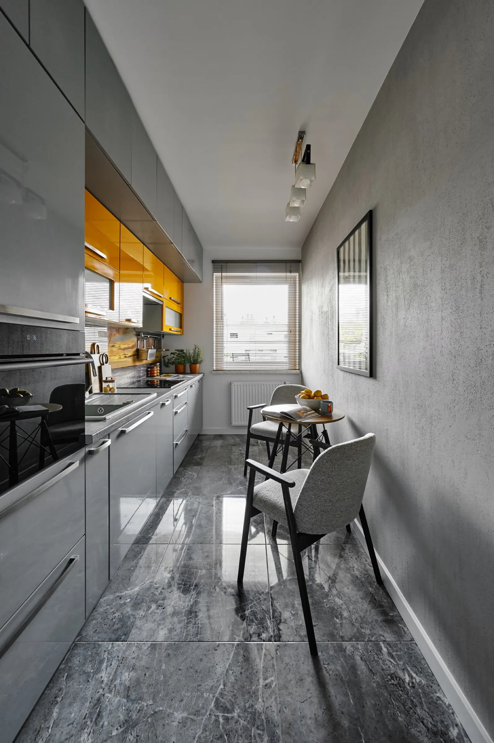 Galley kitchen with a window at the end