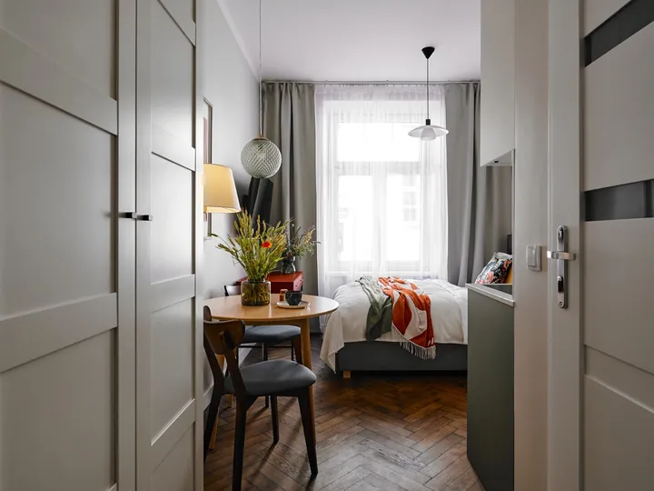 Entering the studio through white doors