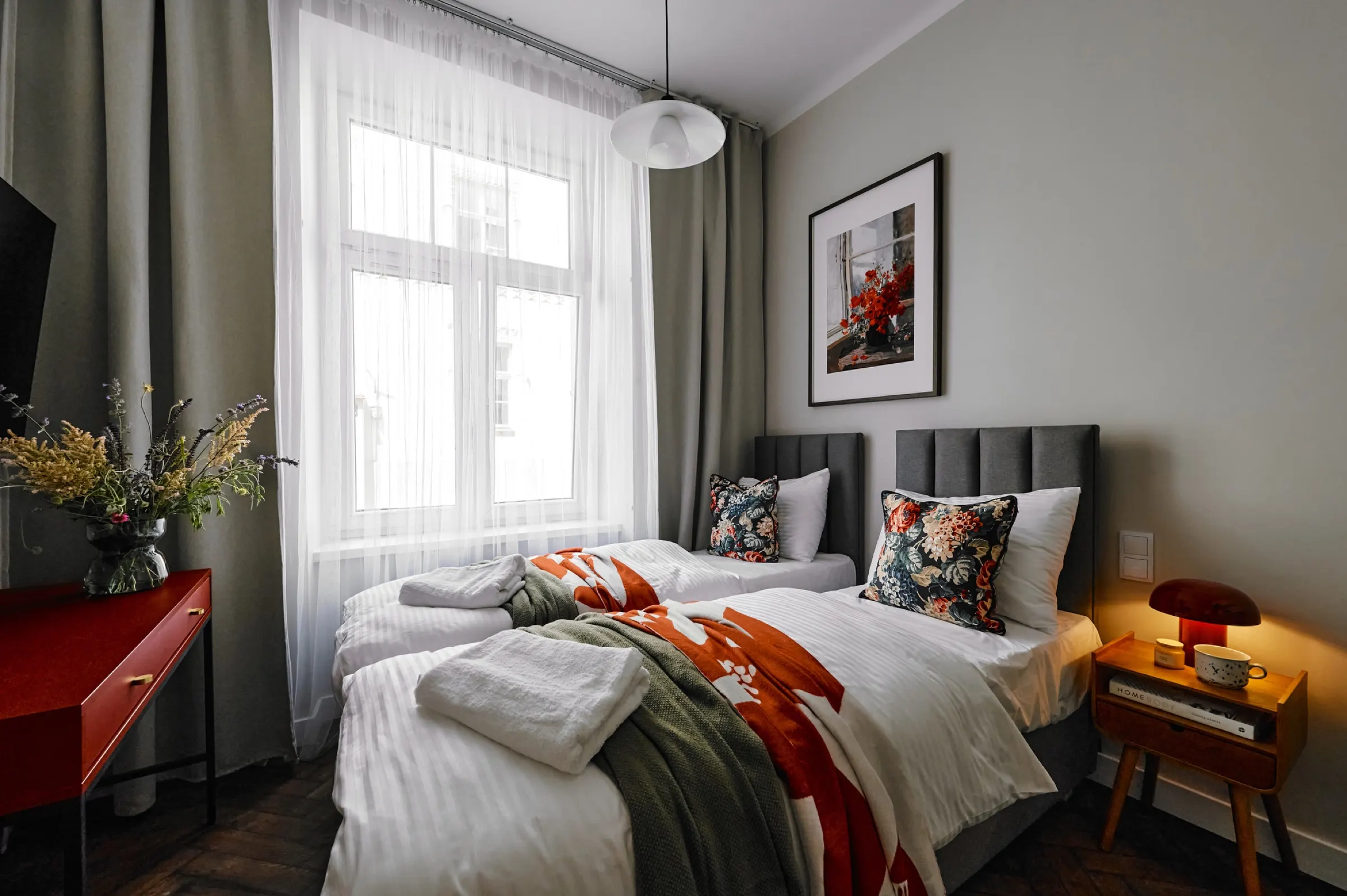 Bed by the tall tenement window