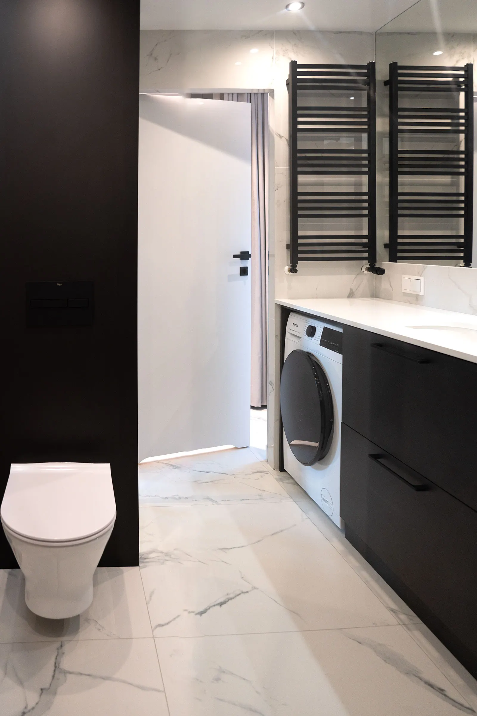 Bathroom with a heated towel rail