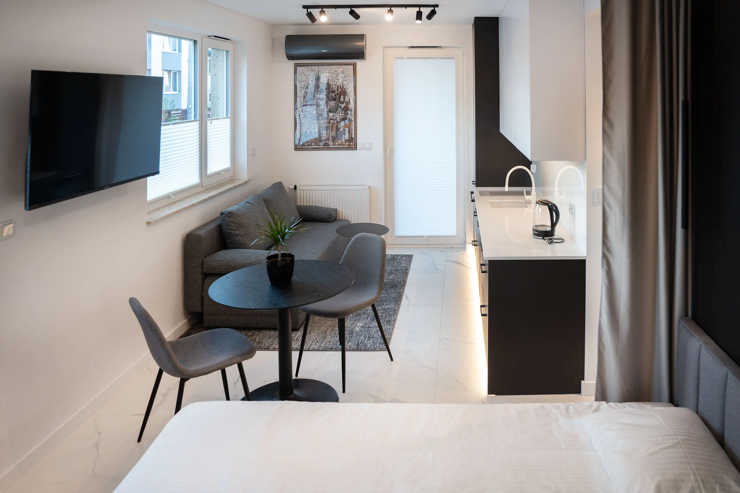 Living area with a sofa, table and air conditioning